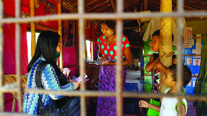 Missionary sharing the gospel with family in Myanmar